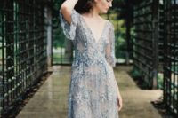 08 a very romantic embellished and embroidered blue wedding gown with a deep V-neckline and short sleeves