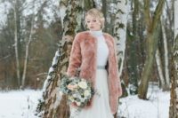 09 a peachc-olored teddy coat is a gorgeous way to add color to your look and stand out in the snow