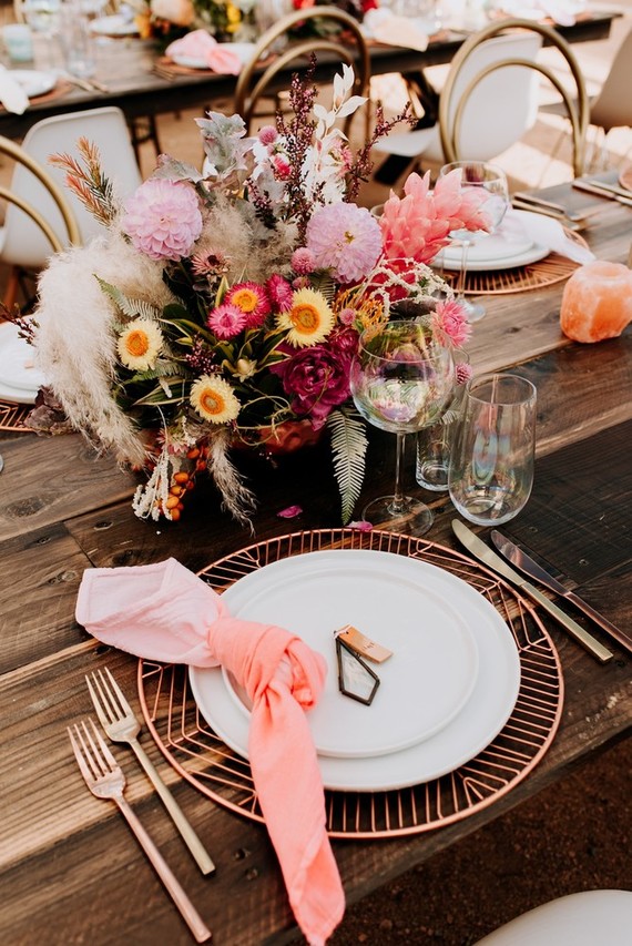 The reception tables were jaw-dropping, with lush bright florals, metallic chargers, copper cutlery and peachy pink napkins