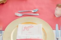 12 a bright tropical wedding table setting with a coral runner and napkin plis a gold charger and candle holders