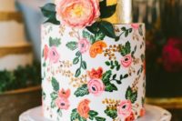 12 a bright wedding cake with a gold foil tier and a colorful floral one in pink and orange with a real bloom on top