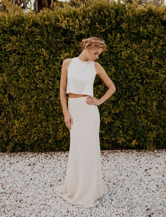 a modern bridal separate with a lace pencil skirt and a plain high neck top with no sleeves