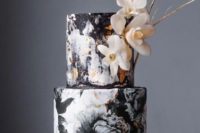 13 a black and white floral wedding cake with gold leaf decor and sugar blooms and gilded twigs for decor