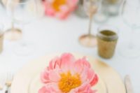 13 a chic and colorful table setting with a gold charger and a bold coral bloom is a great and bright idea