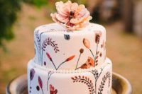 15 a boho handpainted wedding cake in traditional fall colors topped with a sugar flower is great for fall nuptials
