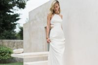 15 a halter neckline wedding dress with side cutouts and a strappy back, simple accessories and loose hair