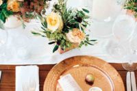 15 a stylish tablescape with a hammered copper charger, peachy blooms in the centerpiece refreshed with whites