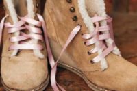 16 cozy and comfortable amber-colored fur boots with pink lacing up is a girlish and fun idea to try