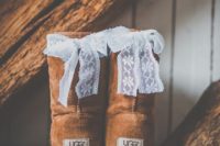 20 ugg boots decorated with little lace bows on the back to show these are bridal boots
