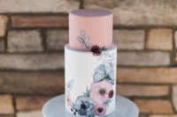 22 a chic and delicate wedding cake with a dusty pink upper tier and a white one with hand painted flowers on it