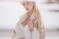 22 a chic white fur hat is a gorgeous idea, match it with a fur capelet for maximal comfort