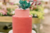 22 a mate coral wedding cake in two shades topped with a sugar bloom and foliage is a bright idea for any modern wedding