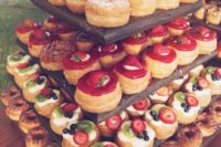 22 serve various mini desserts, be generous with them as many people at this time would love to have some pastries
