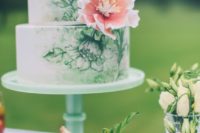 23 a chic handpainted wedding cake in green and white decorated with a single pink sugar bloom