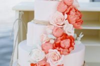 24 a wedding cake decorated with white and coral sugar flowers is a great idea to add colorful touch to the dessert table