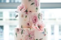 25 a tender pastel handpainted floral wedding cake done in pinks and greens and decorated with natural blooms
