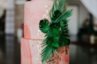 26 marbleized coral wedding cake decorated with gold leaf and sugar tropical leaves is a chic idea for a tropical wedding