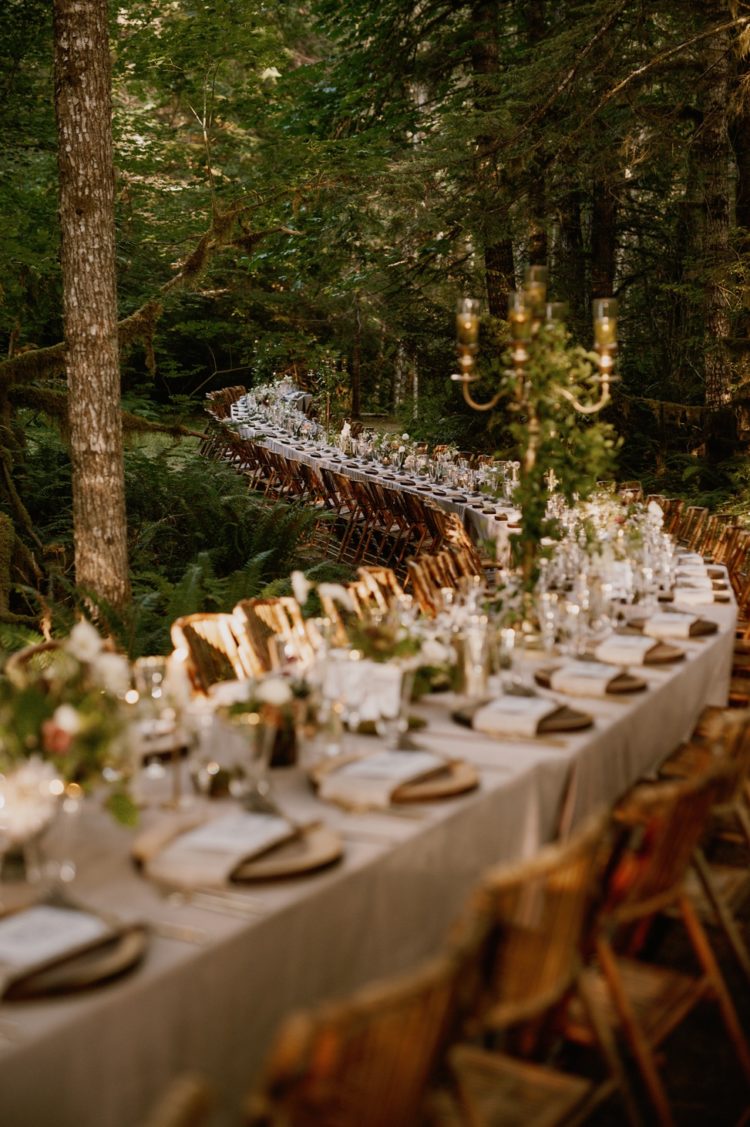 This wedding should be seen at least because of the longest reception table in the woods