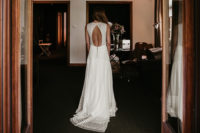 02 The bride was wearing a chic sleeveless A-line wedding dress with a cutotu back, a touch of sparkle and a train