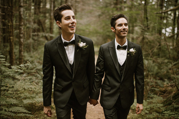 The couple was wearing the same black three-piece suits with bow ties