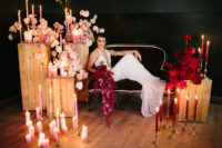 02 The wedding lounge was styled with pink and red blooms and lots of candles plus a velvet coach