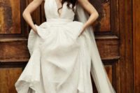02 a modern bridal look with a spaghetti strap A-line wedding dress, a long veil and white Converse for a touch of fun