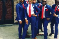 02 bright blue suits, red ties and white shirts for everyone and leopard heels for the lady for a unified look