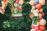 03 a colorful balloon wedding arch with pink and neutral blooms and greenery for a modern wedding