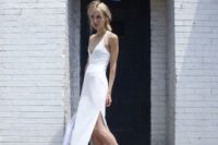 03 a minimalist bridal look with a plain fitting dress with a plunging neckline, side slits and white Converse