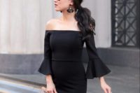 03 an off the shoulder black knee dress with bell sleeves is a modern take on a traditional little black dress, statement earrings and a wooden bag