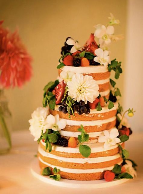 an organic vegan and gluten-free orange blossom wedding cake with lemon curd and vanilla bean cream plus fresh blooms