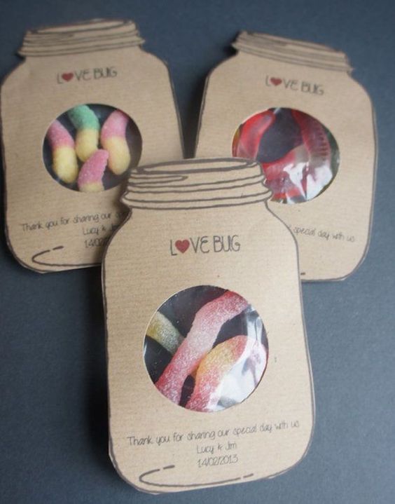 some colorful worm candies packed into cardboard packages with fun letters - this is a completely DIY favor