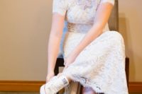 04 a lace fitting wedding dress with a high neckline and short sleeves, white Converse for a casual touch