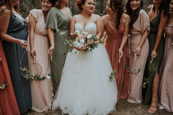 The bridesmaids were rocking mismatching earthy tone maxi gowns