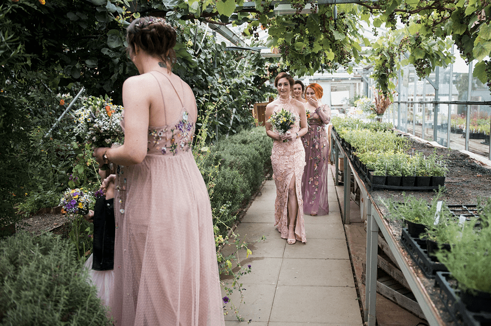 The bridesmaids were rocking mismatching pink floral gowns