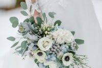 05 The wedding bouquet was done with white, grey and blue blooms and pale greenery