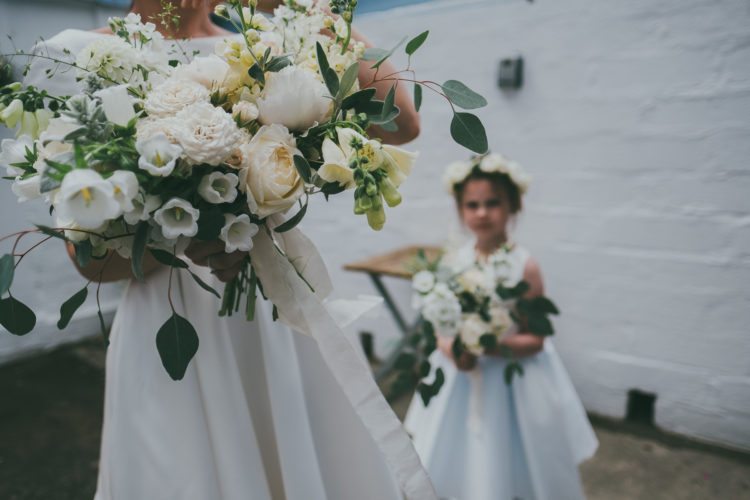 The wedding bouquets were done in neutrals, with blush blooms and greenery