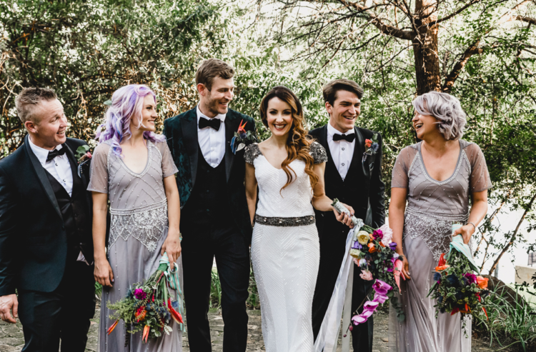 The bridesmaids were wearing embellished grey lilac maxi dresses and the groomsmen were rocking black tuxedos