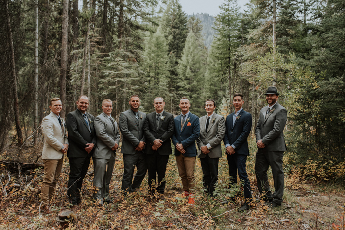 The groom was wearing a three-piece suit in grey and a printed tie, the groomsmen were wearing mismatching looks