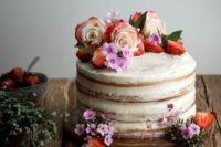 06 a vegan vanilla and berry layer cake with almond milk and fresh raspberries topped with blooms