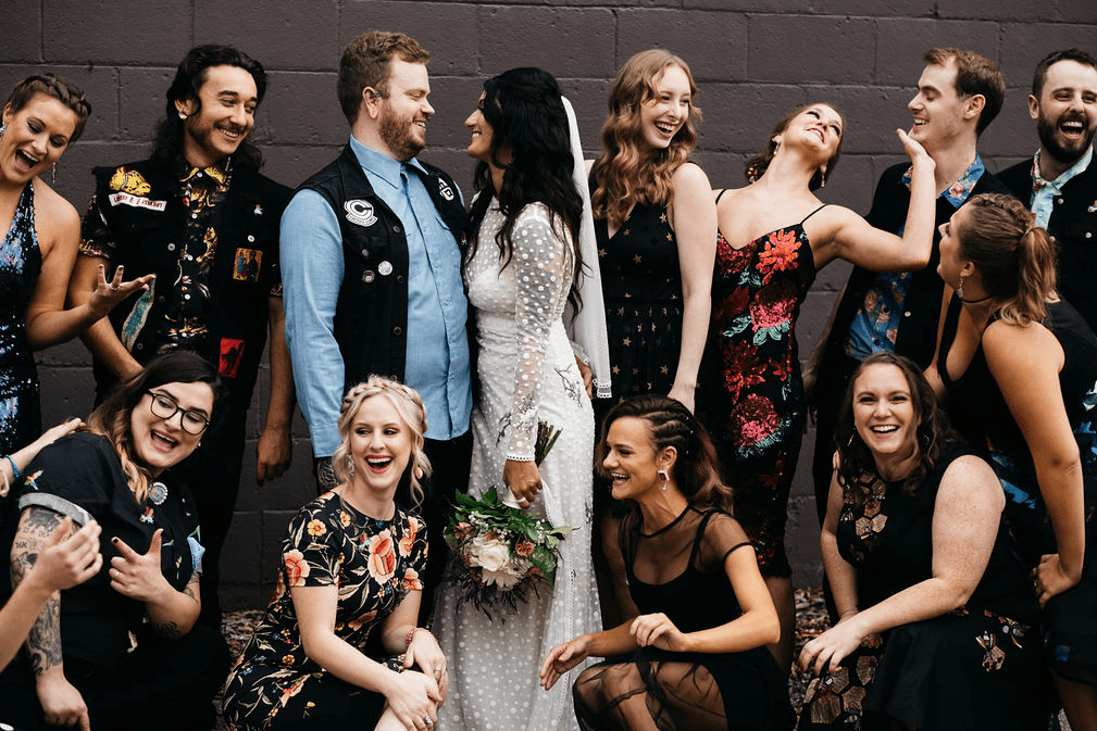 The bridesmaids and groomsmen were wearing self selected eclectic attire for a bright and unique look