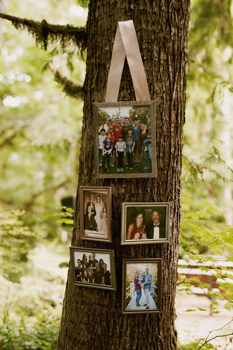 The couple hung some family and friends pics on the trees