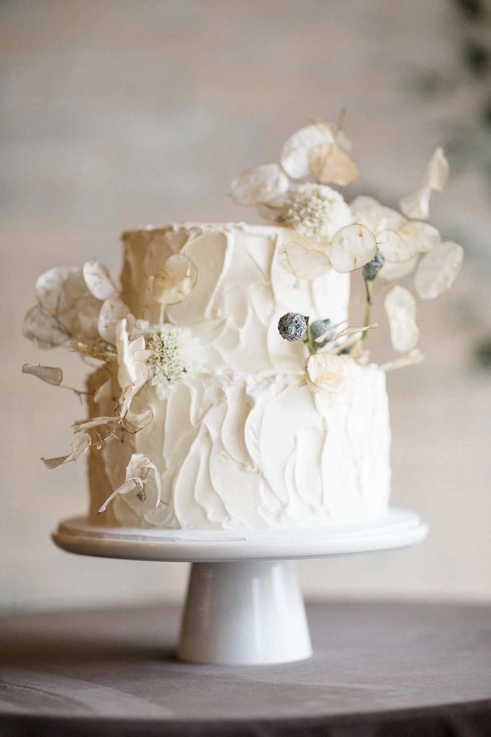 A gorgeous textural wedding cake done with lunaria is ideal for a spring wedding or if you want a refined touch