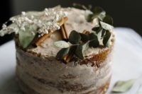 07 a vegan vanilla cake topped with a smooth chai spice icing and greenery, cinnamon bark and blooms
