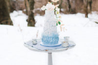 08 The wedding cake was a real masterpiece of cakery art, with painted blue flowers and icy blue shards