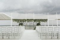08 The wedding ceremony space was all-white with sea views, grids and greenery didn’t prevent seeing them