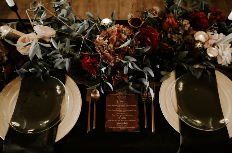 The wedding reception was done in black, burgundy, gold and blush with an elegant and refined feel