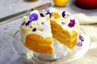 09 a vegan lemon drizzle wedding cake topped with fresh blooms is dairy-free and egg-free