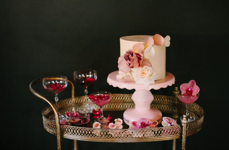 The wedding cake was a neutral one with fresh blooms and petals on top