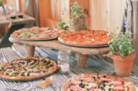 10 a simple rustic pizza bar with various pizzas will delight many guests who love such food